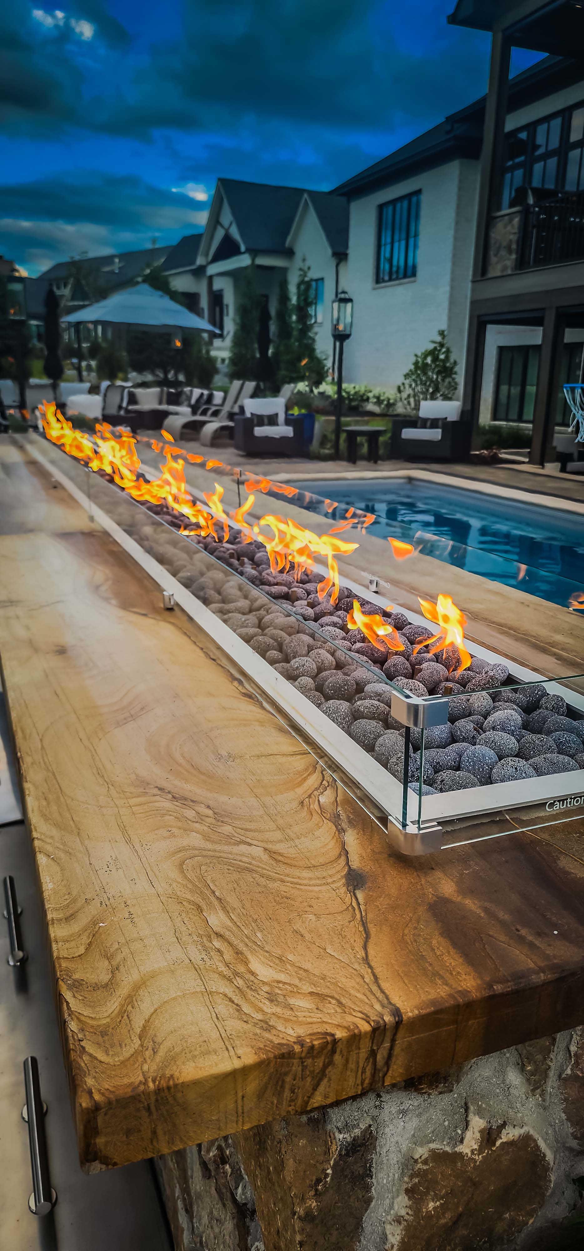 large unique fire element next to swimming pool