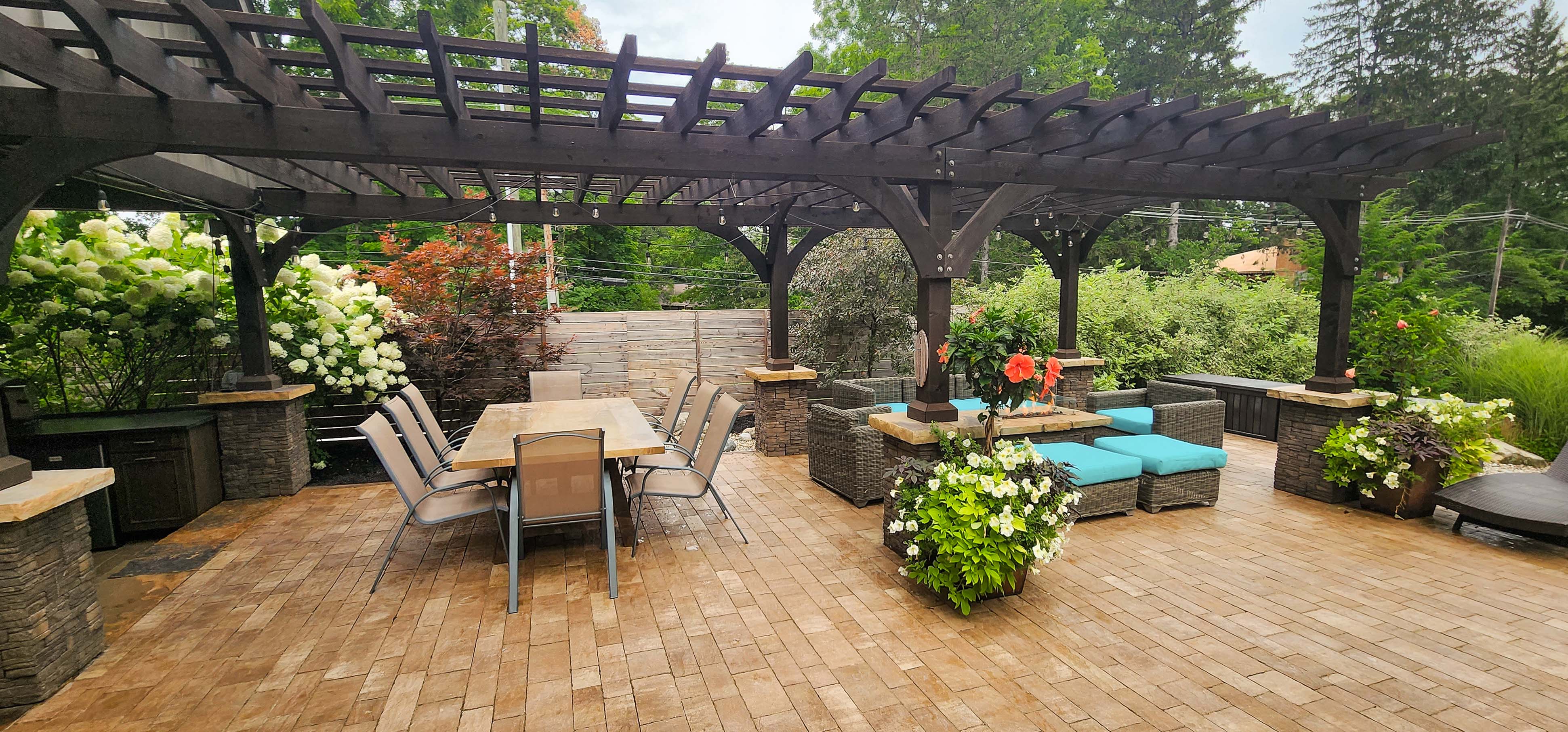 Patio with pergola, landscaping, and fire feature